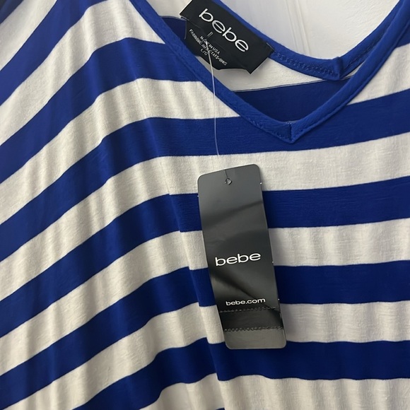 BEBE SEXXXXXY💕
Dress bebe
BEBE Striped Casual blue & white cold shoulder… - Picture 9 of 11